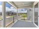 Charming balcony with black railing and outdoor lighting offers stunning neighborhood views and a pleasant outdoor space at 11000 Shining Star Cir, Parker, CO 80134