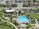 Community pool and clubhouse, showcasing a large pool, surrounding trees, lounging area, and clubhouse amenities at 11000 Shining Star Cir, Parker, CO 80134