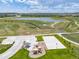 An aerial shot shows the Crescendo Park featuring a playground, picnic shelter, basketball court, and green space at 11000 Shining Star Cir, Parker, CO 80134