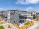 Exterior showcasing a modern home with a balcony, fenced yard, and landscaped surroundings on a sunny day at 11000 Shining Star Cir, Parker, CO 80134