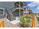 Back of house with a private balcony, stairs, backyard, and a wooden fence providing a secluded outdoor area at 11000 Shining Star Cir, Parker, CO 80134