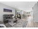 Open-concept living space with comfortable seating and smooth flooring to connect the dining and living room at 11000 Shining Star Cir, Parker, CO 80134