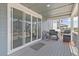 Covered patio with sliding glass doors and grill, perfect for outdoor entertaining and enjoying the weather at 11000 Shining Star Cir, Parker, CO 80134