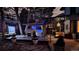 Nighttime backyard featuring an outdoor movie screen, hot tub, and patio seating at 14707 E Wagon Trail Dr, Aurora, CO 80015