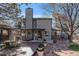 A backyard with a covered patio area, complete with outdoor seating, and a gas grill at 14707 E Wagon Trail Dr, Aurora, CO 80015