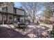 Spacious backyard featuring a deck, seating area, and lush landscaping at 14707 E Wagon Trail Dr, Aurora, CO 80015
