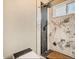 Modern bathroom featuring a sleek shower with designer tile and a spa-like ambiance at 14707 E Wagon Trail Dr, Aurora, CO 80015