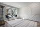 Bedroom featuring custom accent wall, plush rug, and window seat with natural light at 14707 E Wagon Trail Dr, Aurora, CO 80015
