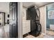 Modern laundry area features a stacked washer/dryer and built in storage with vinyl flooring at 14707 E Wagon Trail Dr, Aurora, CO 80015