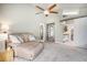 Spacious living room with a comfortable recliner, neutral tones, and multiple doorways enhancing the open layout at 14707 E Wagon Trail Dr, Aurora, CO 80015