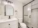 Modern bathroom featuring a glass-enclosed shower and stylish vanity at 1138 W 84Th Pl, Denver, CO 80260
