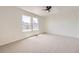 Spacious bedroom with neutral carpet and natural light from large windows at 1138 W 84Th Pl, Denver, CO 80260
