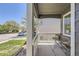 Inviting covered porch featuring a small table, perfect for relaxing outdoors at 1138 W 84Th Pl, Denver, CO 80260