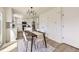 Bright dining area with a modern chandelier and views into kitchen at 1138 W 84Th Pl, Denver, CO 80260