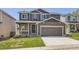 Charming two-story home featuring a covered porch and a two-car garage at 1138 W 84Th Pl, Denver, CO 80260