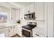 Updated kitchen with stainless steel appliances and granite countertops at 1138 W 84Th Pl, Denver, CO 80260