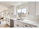 Sleek kitchen with white cabinets, granite countertops and stainless-steel appliances at 1138 W 84Th Pl, Denver, CO 80260