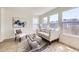 Sun-filled living room with comfortable seating and large windows at 1138 W 84Th Pl, Denver, CO 80260