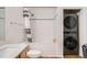 Bathroom includes vanity, shower/tub combo, and a stacked washer and dryer at 1555 California St # 304, Denver, CO 80202