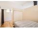 Bedroom featuring hardwood floors, closet access, and neutral wall color at 1555 California St # 304, Denver, CO 80202