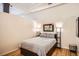 Cozy bedroom featuring hardwood floors, modern lighting, and unique loft style design at 1555 California St # 304, Denver, CO 80202