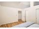 Well-lit bedroom with hardwood floors and spacious closet with easy access at 1555 California St # 304, Denver, CO 80202