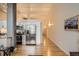 Contemporary kitchen features stainless steel appliances, white cabinetry, and hardwood floors at 1555 California St # 304, Denver, CO 80202
