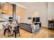 Cozy living room with hardwood floors, modern furniture, and a connected kitchen at 1555 California St # 304, Denver, CO 80202