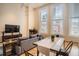 A modern living room with stylish decor, large windows, and a cozy seating area at 1555 California St # 304, Denver, CO 80202