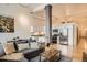 An open-concept living room and kitchen with stainless steel appliances, offering a modern living space at 1555 California St # 304, Denver, CO 80202
