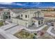 Aerial view showcasing a modern home with a well-manicured yard and a private yard at 1734 Peak Prairie Ln, Monument, CO 80132