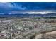 Aerial view of community showcasing mountain views in the distance at 1734 Peak Prairie Ln, Monument, CO 80132
