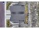 Overhead view highlighting the property layout with its spacious driveway and tidy landscaping at 1734 Peak Prairie Ln, Monument, CO 80132