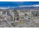 Aerial view of the home showing the backyard patio and landscaping of the property at 1734 Peak Prairie Ln, Monument, CO 80132