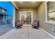 Back patio features comfortable seating, offering a seamless indoor-outdoor living experience at 1734 Peak Prairie Ln, Monument, CO 80132