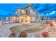 Home backyard featuring a covered patio, open yard, and nice view, perfect for enjoying the outdoors at 1734 Peak Prairie Ln, Monument, CO 80132