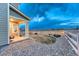 Home backyard featuring well-maintained landscaping and beautiful fence at 1734 Peak Prairie Ln, Monument, CO 80132