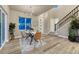 Bright open-concept dining area with stylish lighting and staircase at 1734 Peak Prairie Ln, Monument, CO 80132