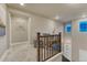 Upstairs hallway with carpet and natural light at 1734 Peak Prairie Ln, Monument, CO 80132