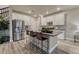 Kitchen featuring granite counters, stainless steel appliances, and seating at the island at 1734 Peak Prairie Ln, Monument, CO 80132