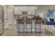 Well-lit kitchen with stainless steel appliances and open view of the living area at 1734 Peak Prairie Ln, Monument, CO 80132