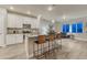 Spacious kitchen featuring a kitchen island with bar seating, and a modern layout at 1734 Peak Prairie Ln, Monument, CO 80132