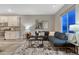 Cozy living room features plush seating, neutral decor, and ample natural light at 1734 Peak Prairie Ln, Monument, CO 80132