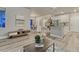 Open-concept living space with modern kitchen, dining room, and stylish decor at 1734 Peak Prairie Ln, Monument, CO 80132