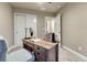 Home office features a wooden desk, and neutral decor at 1734 Peak Prairie Ln, Monument, CO 80132