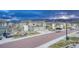 Inviting two-story home featuring an attached two car garage, manicured landscaping, and charming architectural details at 1734 Peak Prairie Ln, Monument, CO 80132