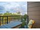 Relaxing balcony with furniture offering views of the city skyline and lush trees, perfect for outdoor enjoyment at 3069 Tejon St # B, Denver, CO 80211