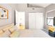 Cozy bedroom with neutral tones, a comfortable bed, and a view through the open doorway at 3069 Tejon St # B, Denver, CO 80211