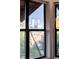 A window frames a view of the city skyline, showcasing modern architecture and urban landscapes at 3069 Tejon St # B, Denver, CO 80211