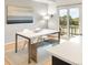 Bright dining area featuring a modern table, bench seating and sliding doors to the outside at 3069 Tejon St # B, Denver, CO 80211